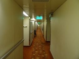 narrow carpeted corridor