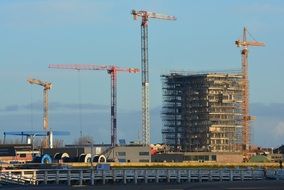 tower cranes at building on construction site