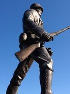 first world war soldier with rifle, side view, bronze monument