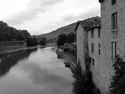 old buildings on riverside at mountain, france, saint-antonin-noble-val