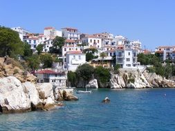 picturesque white villas on rocky coast, greece