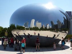 people looking at mirroring surface of cloud gate sculpture, usa, illinois, chicago