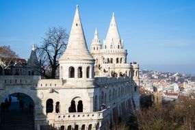 towers of Fisherman's Bastion in front of city at fall, hungary, budapest