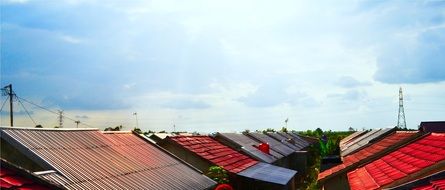 colorful roofs of houses under clouds