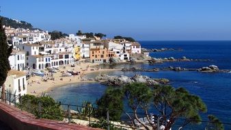 sand beach at old town in scenic bay, spain, calella de palafrugell