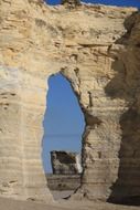 view of rocks formations through opening in rock, usa, kansas