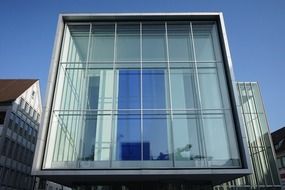 Glass facade of a building in the form of a cube