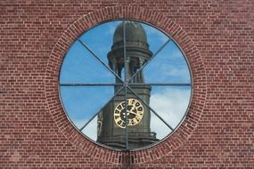 reflection of church tower in a window