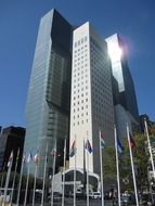 flags at skyscraper on united nations plaza, usa, new york city