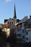 houses against the background of the church building