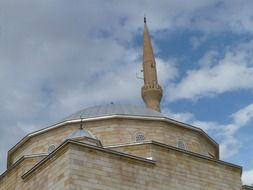 minaret behind dome of mosque, turkey, avanos