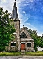 aged stone church at summer on Lake Champlain