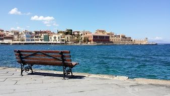 free bench on waterfront at mediterranean sea, greece, crete