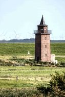 tower of dagebüll lighthouse in countryside, germany