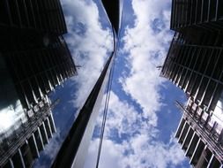 high-rise building under construction with reflection on glass facade