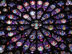 Colorful stained-glass window in the cathedral of Notre Dame, paris