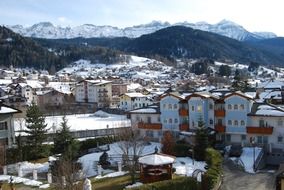 city near snowy mountains