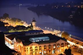 night city lightened houses river view