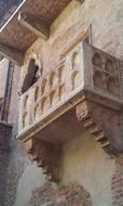 Julietâs balcony on facade of Casa di Giulietta, italy, verona