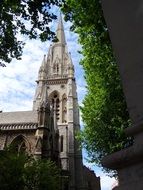 St Mary abbey, gothic church spire among trees at sky, england, london