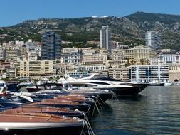 anchored boats and yachts in port at city, monaco