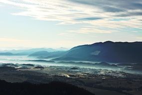 countryside in mountain valley, beautiful scenic misty landscape