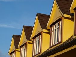 colorful roof windows in row at sky