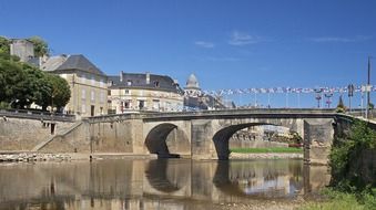 stone bridge near a building in france