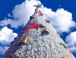 blue sky over white christmas tree