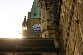 clock on facade of parliament building at morning, canada, ottawa