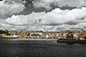 skyline of city under fluffy clouds, uk, england, scarborough