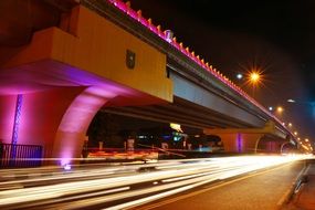 photo of night traffic in the night city