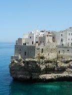 houses on a rock in the sea