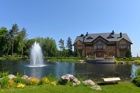 Luxurious mansion pond fountain on garden scene