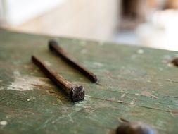 nails lie on a wooden table