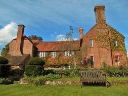 overgrown with ivy brick house