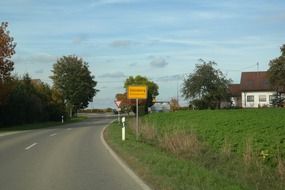 yellow sign of town steinberg on the road