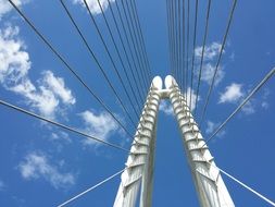 iron bridge against the sky with white clouds