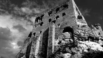 black and white photo of the destroyed castle in poland