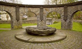 stone millstone monument in rotunda