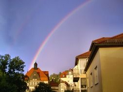 rainbow over old city after rain