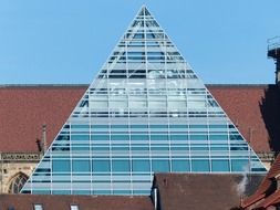 glass pyramid on the roof of the house