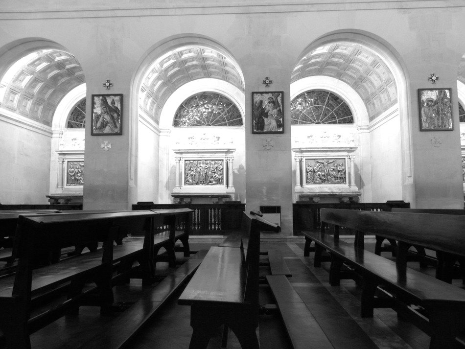 benches at windows in church, portugal