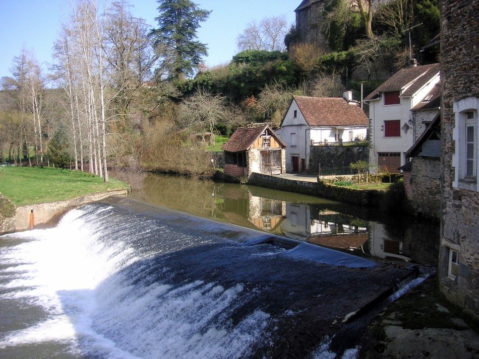 landscape of weir on river at village