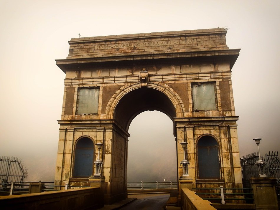 The arch on the wall of Hartbeespoort dam in mist, South Africa