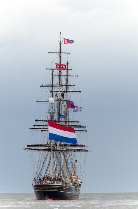 sailing ship with netherlands flag on sea