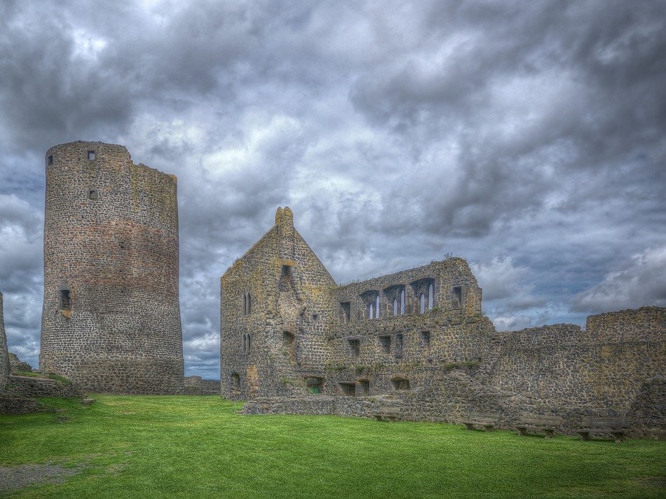 ruins of medieval knight’s castle at clouds