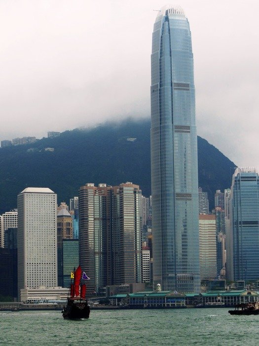 Two International Finance Centre skyscraper in city at foggy mountain in china, hong kong