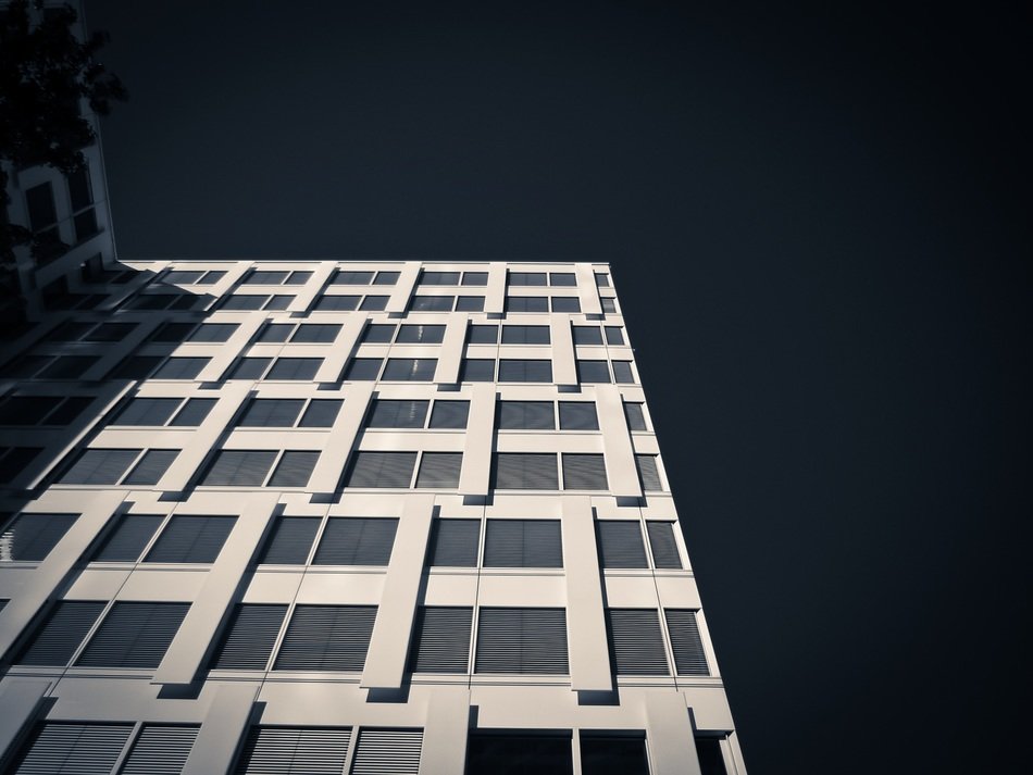 Bottom view of the facade of a skyscraper