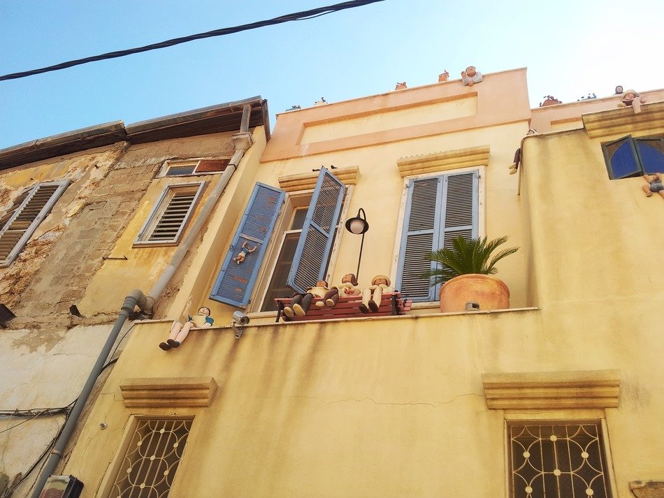 windows with shutters on a building in Tel Aviv, Israel